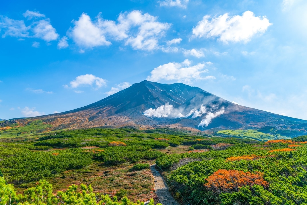 Scenic view of Mount Asahidake during a Travellers Autobarn Japan campervan road trip in Daisetsuzan National Park, Hokkaido, Japan.