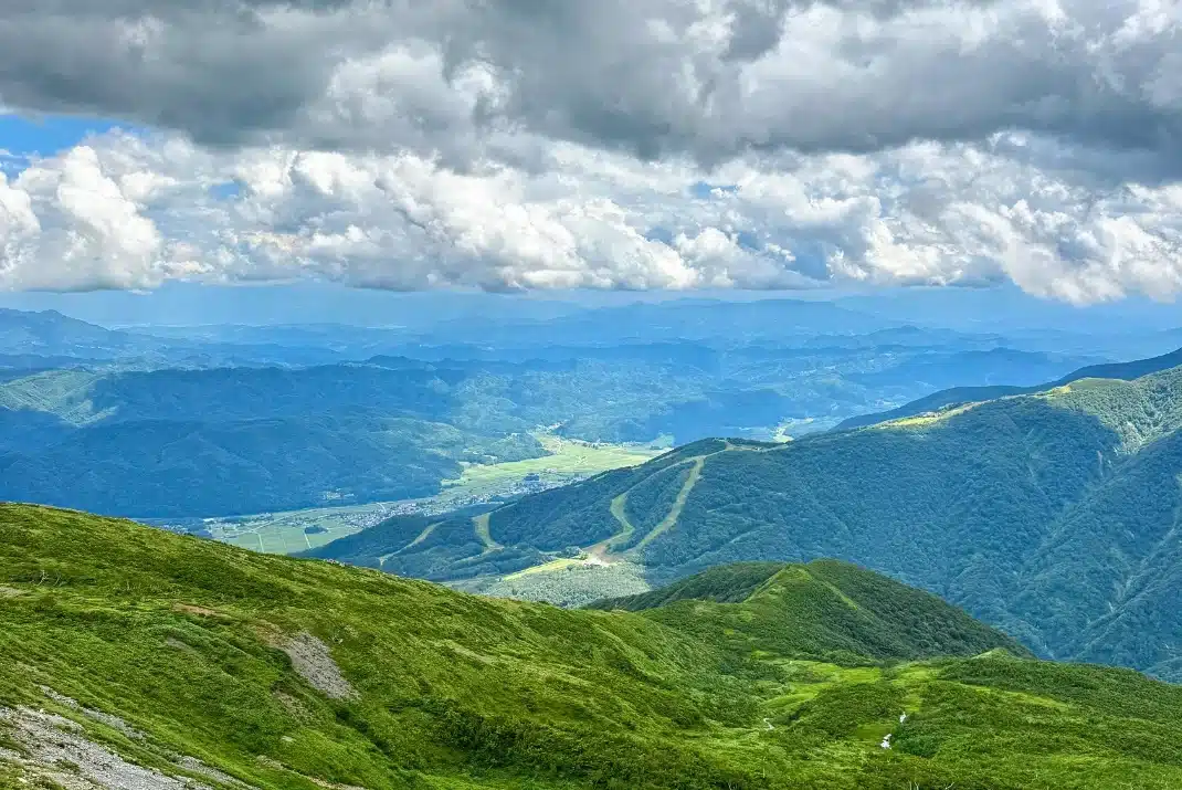 Panoramic summer mountain view from Hakuba Happo-one ridge trek in Japan Alps